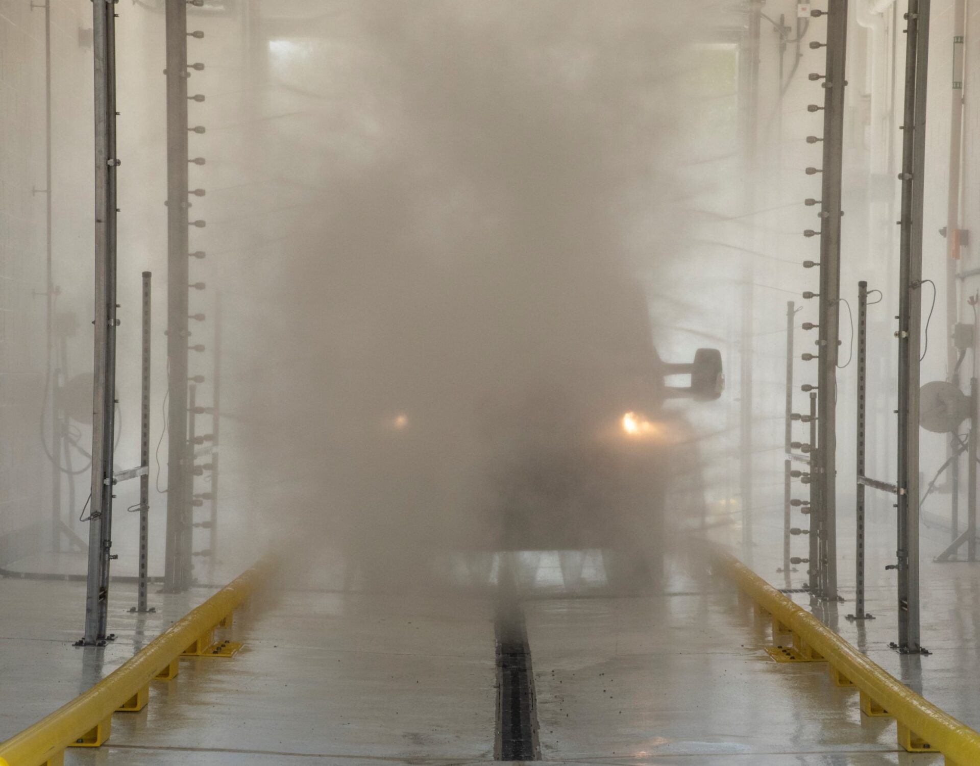 van in an automatic wash system