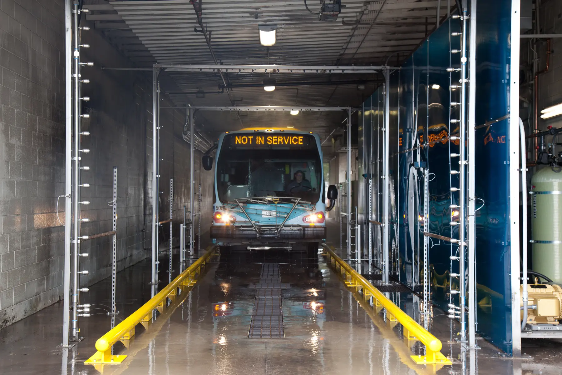 Bus driving-thru a new bus wash installation, Missoula, MT